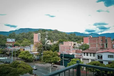 a view of a city with buildings and a street at Amplio duplex con terraza privada. in Medellín