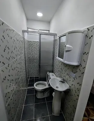 a bathroom with a shower and a toilet and a sink at SAN SENDERISMO ROOM in Mariquita