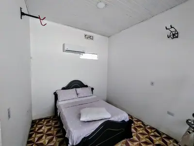 a small room with a bed in the corner at SAN SENDERISMO ROOM in Mariquita