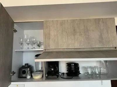 a kitchen with wine glasses and a counter top at Apto Familiar in poblado in Medellín