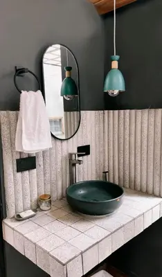 a bathroom with a black sink and a mirror at Ceiba del Agua in San Rafael