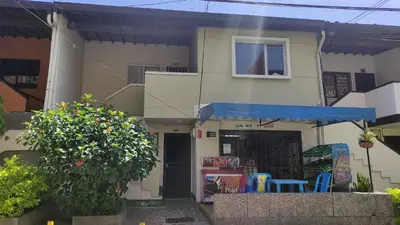 a house with a blue table in front of it at Habitación sencilla y central #6 in Medellín