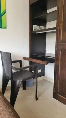 a desk and a chair in a room at Habitación en apartamento compartido en Envigado in Envigado