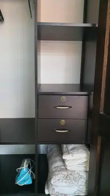 a shelf with a dresser and a shoe in a closet at Habitación en apartamento compartido en Envigado in Envigado
