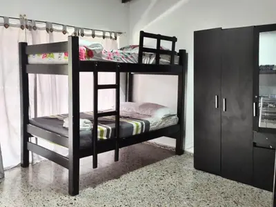 a couple of bunk beds in a room at CASA ESTADIO MEDELLIN Amplio Apartamento Renovado para Familias, Grupos o Delegaciones Deportivas cerca al Estadio Atanasio Girardot - Laureles-Estadio in Medellín