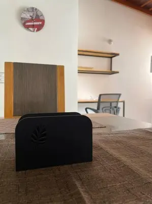 a black suitcase sitting on the floor in a room at Ideal para grupos y nómadas Apto 2 hab amplio in Sabaneta