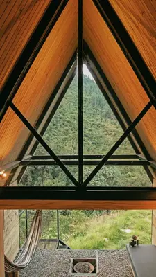 a view from the inside of a wooden roof at Ecolodge Cuentos de Agua in Villamaría