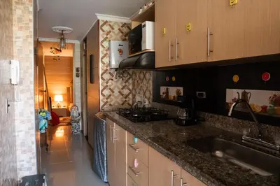 a kitchen with a sink and a counter top at Elegante apartamento: Sabaneta Central in Sabaneta