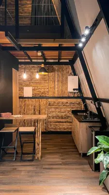 a dining room with a table and a counter at Cabaña 25km de Medellín, Benevento Reserva Botánica in Girardota