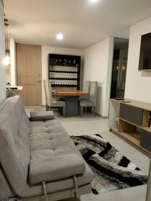 a living room with a couch and a table at Apartamento Sabaneta Antioquía in Sabaneta