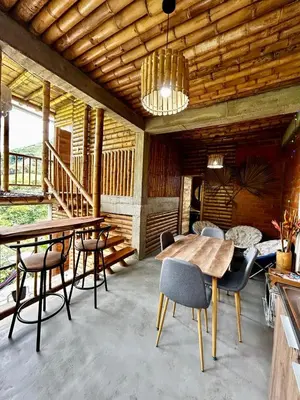 a dining room with a table and chairs at Cabaña campestre para parejas o grupos in Manizales