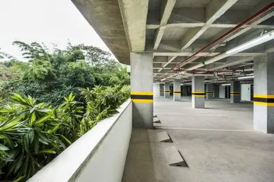 an empty parking garage with yellow and black stripes at Hotel en Rionegro-Rioverde- Apartamento in Rionegro