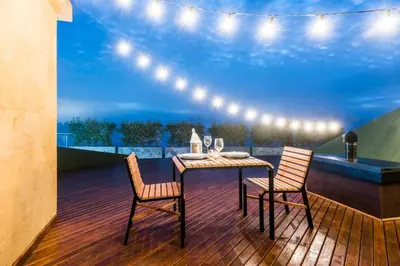 a table and two chairs on a deck with a view at Hotel en Rionegro-Rioverde- Apartamento in Rionegro