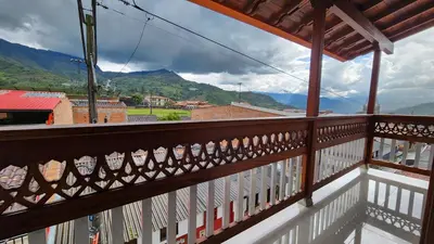 a balcony with a view of the mountains at OCASSO JARDIN APARTAMENTO COLIBRÍ in Jardin