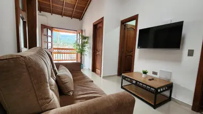 a living room with a couch and a coffee table at OCASSO JARDIN APARTAMENTO COLIBRÍ in Jardin