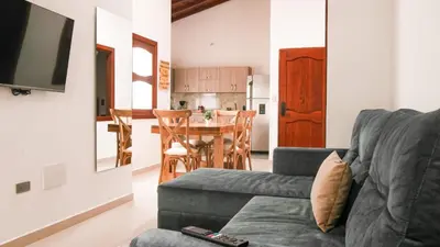 a living room with a couch and a table at OCASSO JARDIN APARTAMENTO GALLITO DE ROCA in Jardin