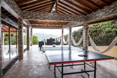 a ping pong room with a ping pong table at Finca Villa Isanella, Santuario, Antioquia in Santuario