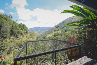 a balcony with a view of a mountain at Cabaña / hotel campestre en Manizales para pareja in Manizales
