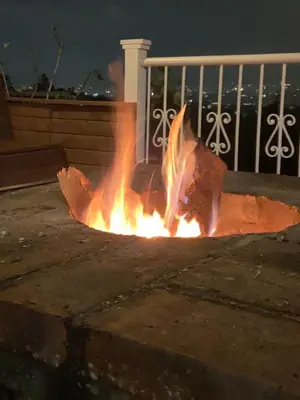 a fire is burning in the street at night at AEROPUERTO-Rionegro- MONTEOLIVO COLONIAL in Rionegro