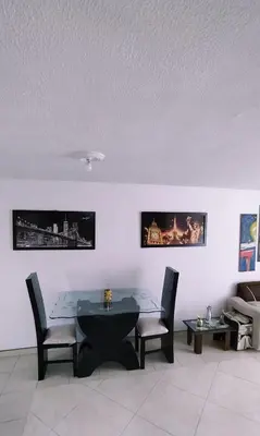 a dining room with a table and chairs at apartamento centro de la ciudad in Medellín