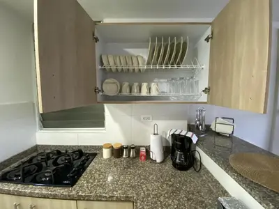 a kitchen counter with a stove top in a kitchen at Apartamento Mirador De Castilla in Manizales