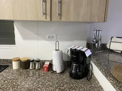 a kitchen counter with a coffee maker and a blender at Apartamento Mirador De Castilla in Manizales
