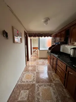 a kitchen with a tile floor and a counter top at HOSTAL LA CASA DE LOS SUEÑOS in Jardin