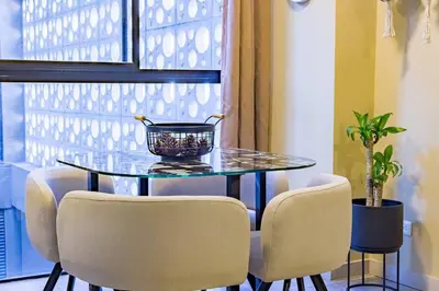a dining room table with chairs and a bowl on it at Apartamento Tranvía 210 in Medellín