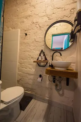a bathroom with a sink and a mirror at CASA HOTEL LAS HORTENSIAS in Jardin