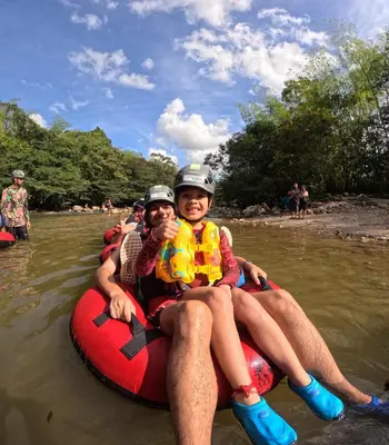 a group of people on a raft in the water at Cabañas para parejas cerca a Medellín - LUUM By Roots Rentals in Marinilla