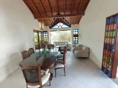 a dining room with a glass table and chairs at Casa Campestre 1 Nivel para 9H , Poblado San Lucas 110 in Medellín
