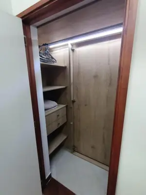 a walk in closet with a glass door at Loft campestre con terraza en el Poblado apt 113 in Medellín