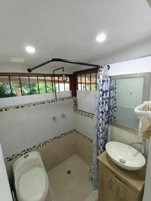 a bathroom with a toilet and a sink at Loft campestre con terraza en el Poblado apt 113 in Medellín
