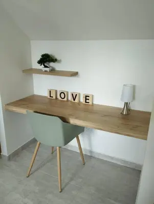 a wooden desk with the word love written on it at Apto Nuevo, Tranquilo, Bonito, 5 min Plaza Principal in Guatapé