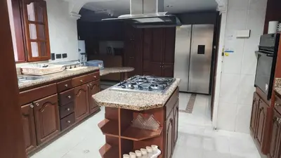 a kitchen with a stove top oven in a kitchen at Paisa Hostel Medellín in Medellín