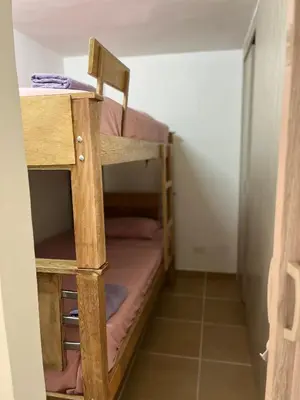 a room with two bunk beds in a room at Laurel de Florida Apto in Medellín
