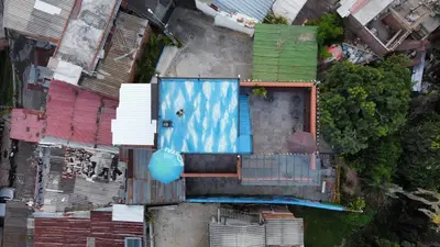 an overhead view of a building with a swimming pool at Hostal Del Cielo in Medellín