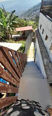 a stairway leading up to a building with at Casita el mirador solo naturaleza in Medellín