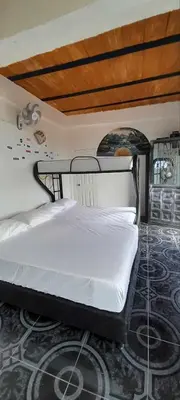 a bedroom with a bed in a room at Casita el mirador solo naturaleza in Medellín