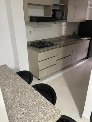 a kitchen with a counter and a stove top oven at Apartamentos amueblados, zona céntrica-Cisneros- antioquia in Cisneros