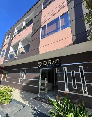 a building with a sign that reads akirino at ZAFIRO HOTEL in Doradal