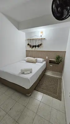 a bedroom with a large bed in a room at HOTEL BOHO BOUTIQUE in Quibdó