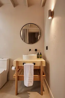 a bathroom with a sink and a mirror at Antipoda Hotel Boutique in Medellín