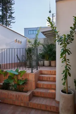 a set of stairs with plants on a house at Antipoda Hotel Boutique in Medellín