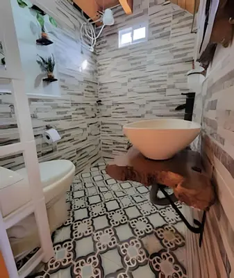 a bathroom with a sink and a bath tub at Cabaña Entre Aguacates, Refugio en Marinilla in Marinilla