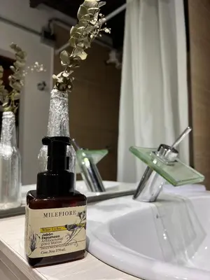 a bottle of mulleton moisturizing soap sitting on a bathroom sink at Casa & cabaña campestre equipadas, 13 personas, familias in Jardin