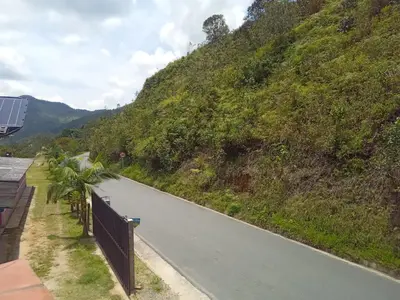a road on a hill with a fence on the side at HOSPEDAJE MARIN in Concepción