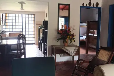 a living room with a kitchen and a dining room at La Escondida, con acceso al lago in Guatapé