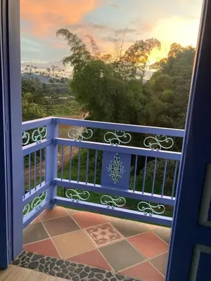 an open door to a balcony with a view at Apartahotel Villa Carolina 4 in Jericó