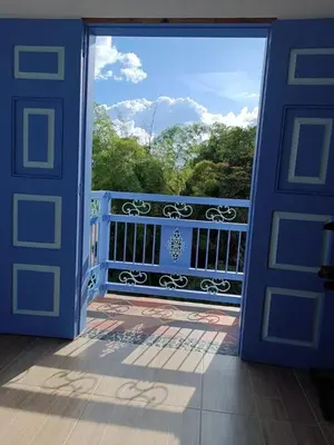 an open door to a balcony with a view at Apartahotel Villa Carolina 4 in Jericó